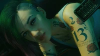 Judy Alvarez: A Cyberpunk Icon with Intricate Tattoos and Vibrant Hair