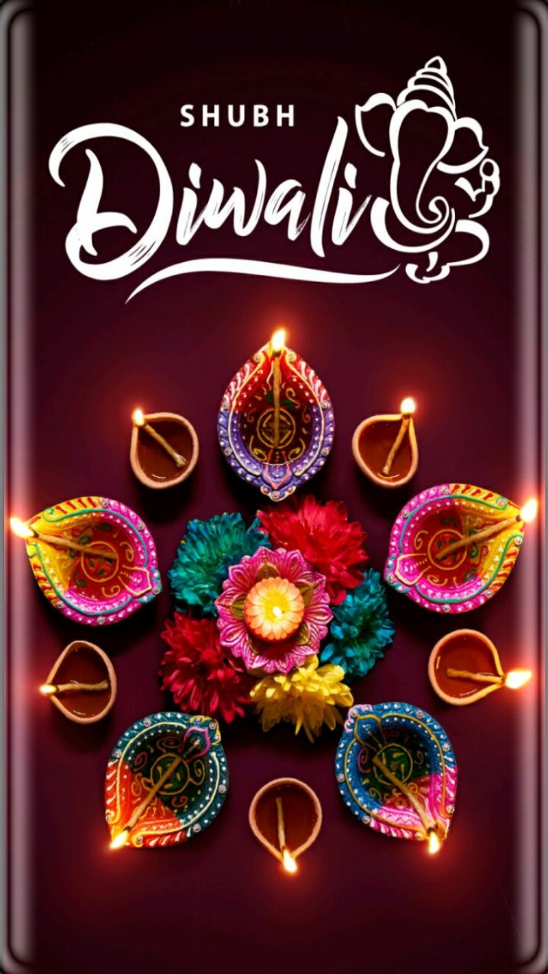 A colorful diwali with candles and flowers on a dark background (thawait, vikrant)