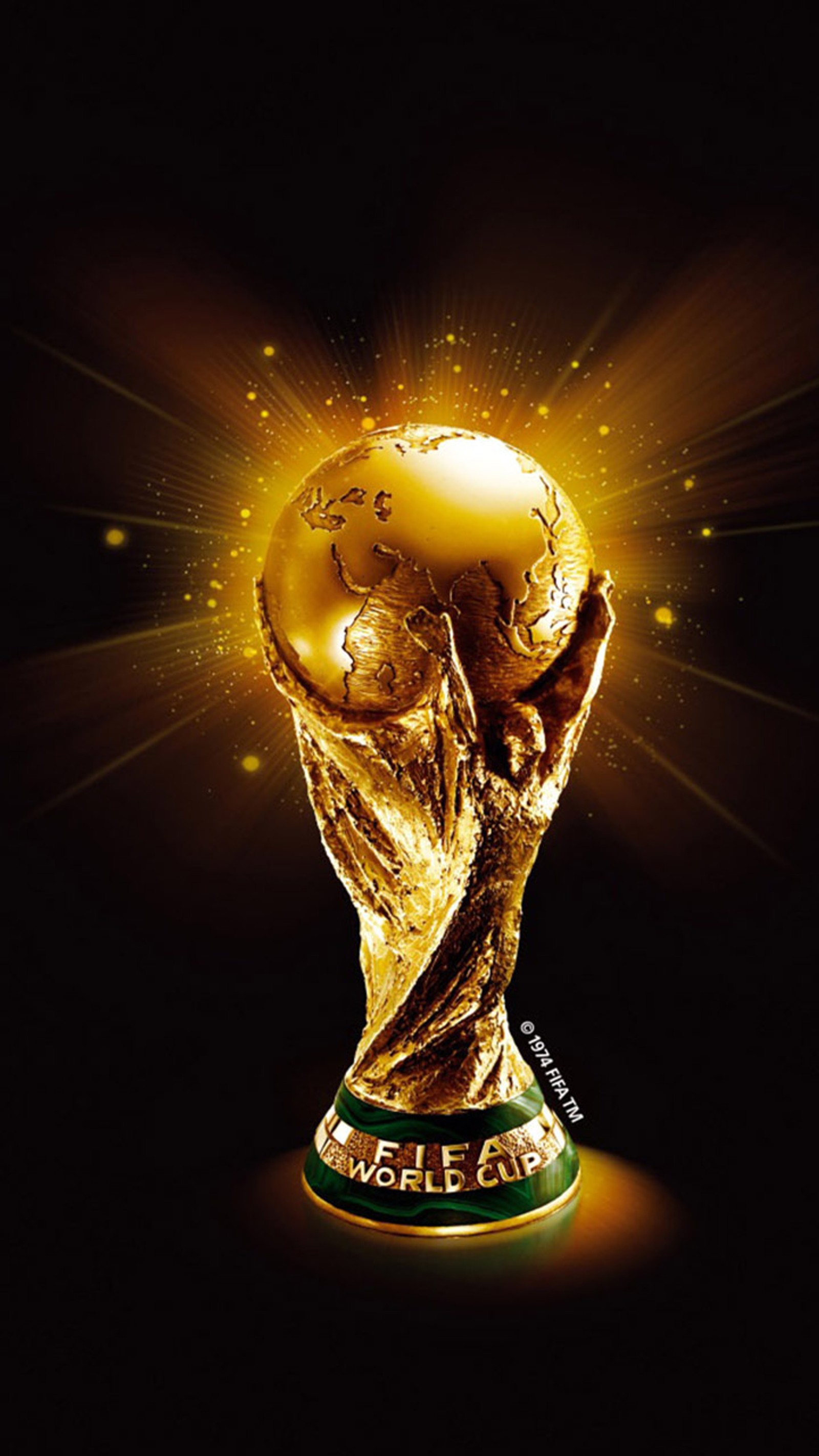 A close up of a soccer trophy with a gold ball (cup, world)