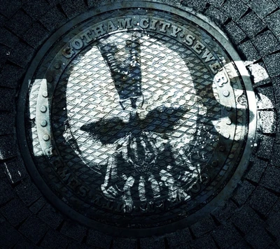 Gullydeckel der Kanalisation von Gotham City mit dem Emblem von Batman