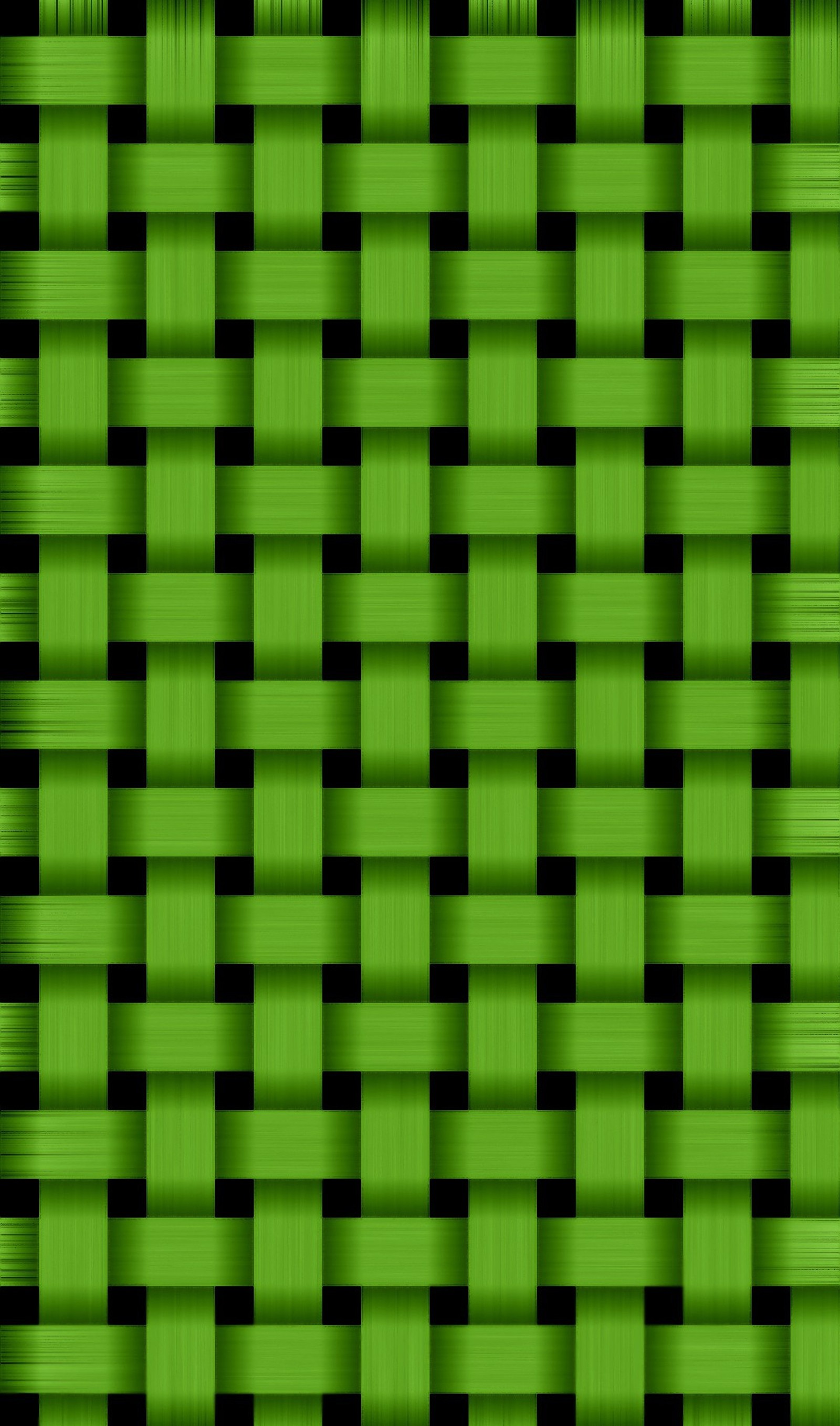 A close up of a green and black checkered pattern (abstract, green weave)