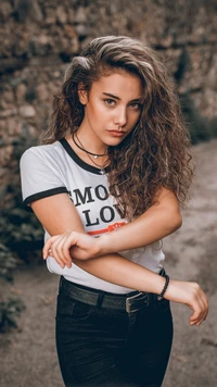 Confident Portrait of a Young Woman with Curly Hair