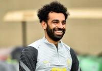 Mohamed Salah souriant lors de la séance d'entraînement de Liverpool FC