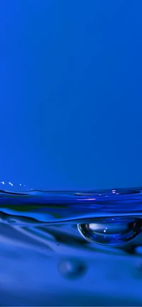 Electric Blue Liquid Surface with Gentle Ripples