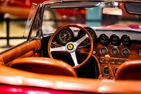 Classic Sports Car Interior with Wooden Steering Wheel and Analog Gauges