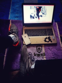 Casual Setup: Sneakers, Laptop, and Smartphone