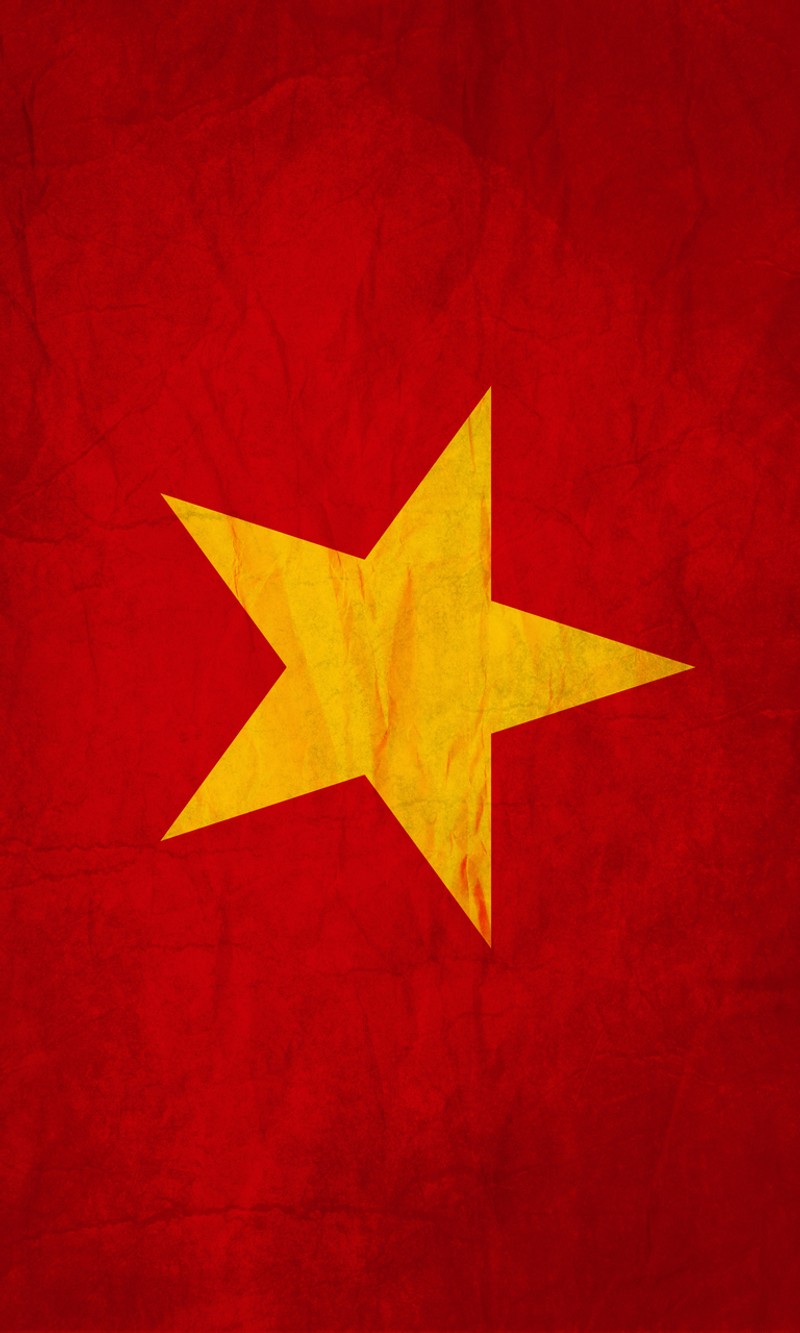 Близкий план красной и желтой звезды на красном фоне (флаг, вьетнам, vietnam)