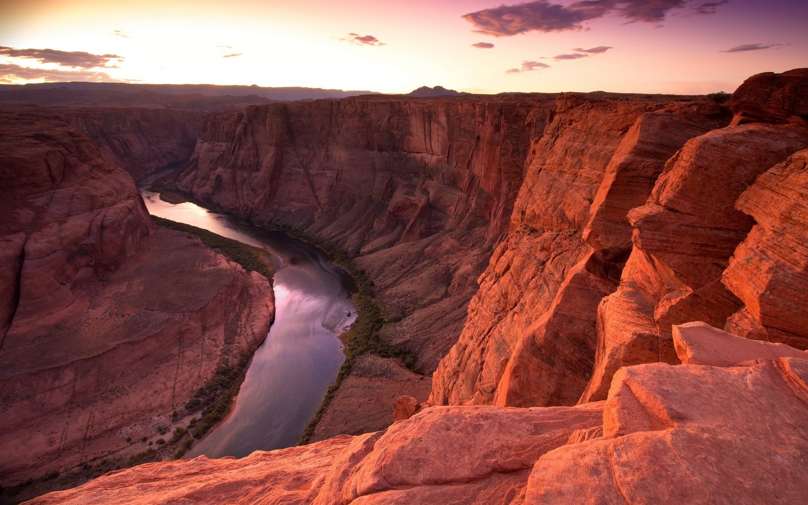 A view of a river running through a canyon next to a cliff (formation, nature, badlands, rock, canyon)