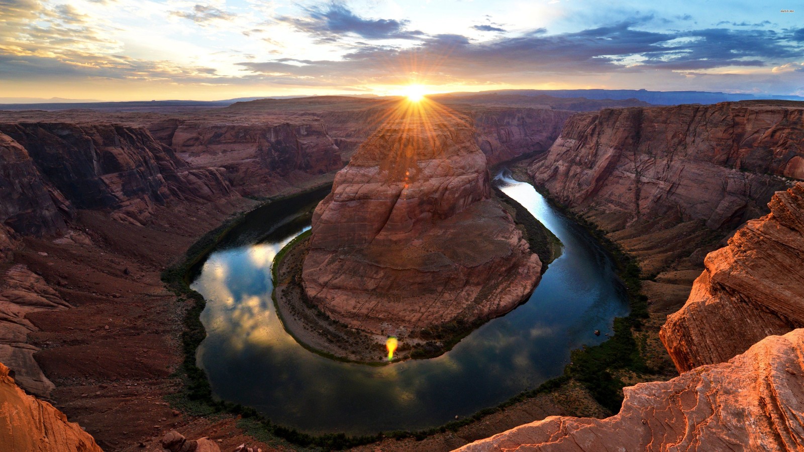 A view of a river running through a canyon at sunset (canyon, horseshoe bend, lake powell, formation, rock)