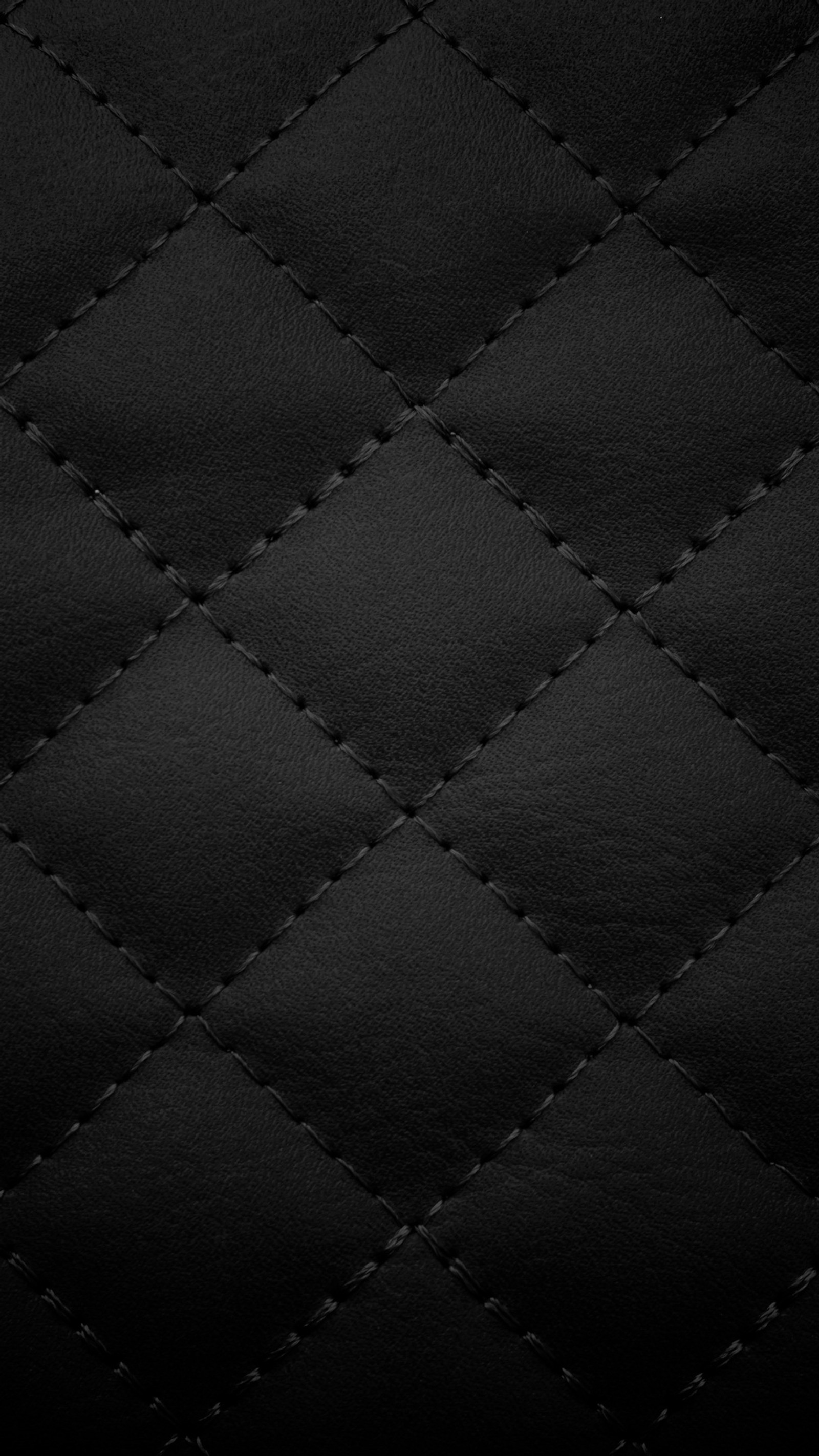 Gros plan d'une texture en cuir noir avec un motif en diamant (noir, tissu, cuir, luxe, motif)