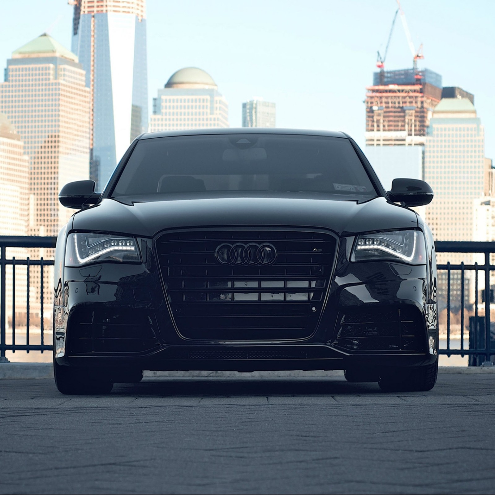 A close up of a car parked on a city street (audi car, auto, car, lovely car, new car)