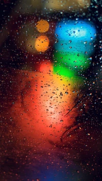 Luces coloridas abstractas a través de gotas de lluvia