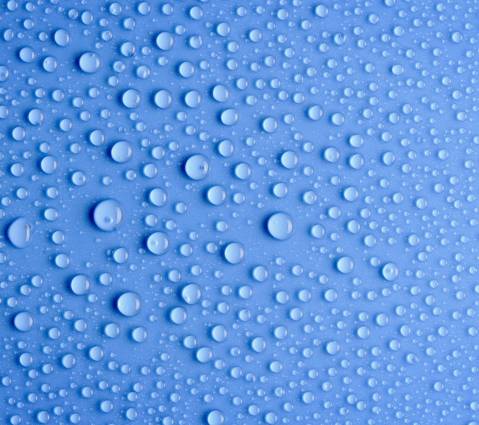 A close up of water droplets on a blue surface (blue, drop, wallpaper)