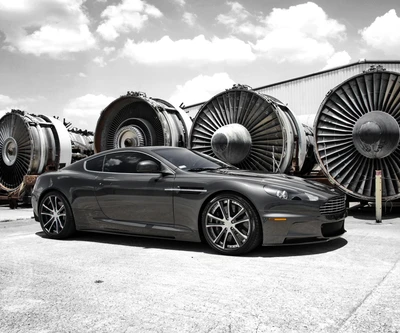 Aston Martin Tuned: A Sleek Beauty Beside Vintage Turbine Engines