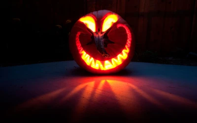 Glowing Halloween Pumpkin with Sinister Carving