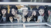 Illit K-Pop Group: Playful Members Behind Glass