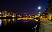 Vibrant Cityscape Reflection at Night with Illuminated Landmark