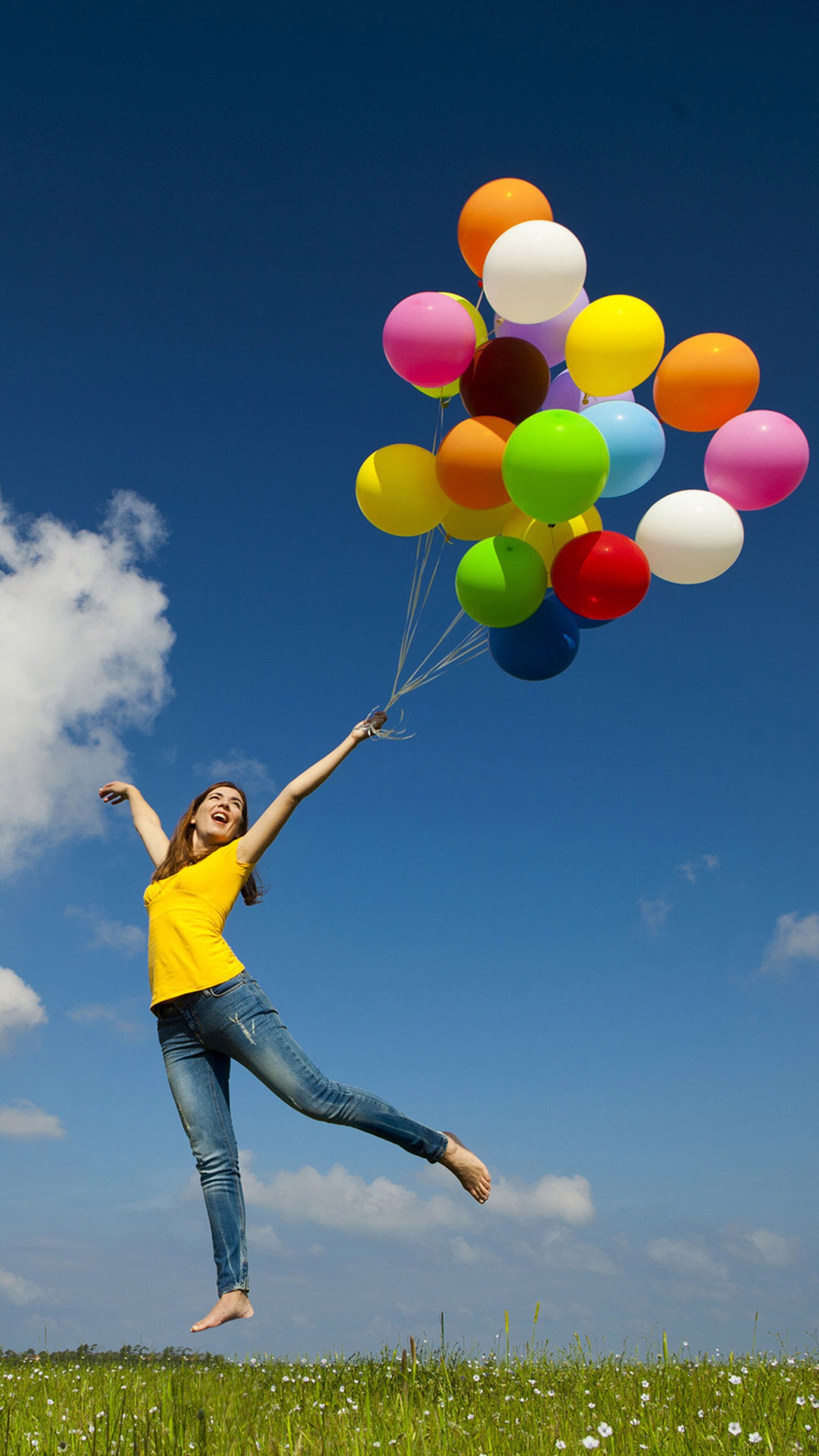 Araffe jumping in the air with balloons in the air (girl, happy)