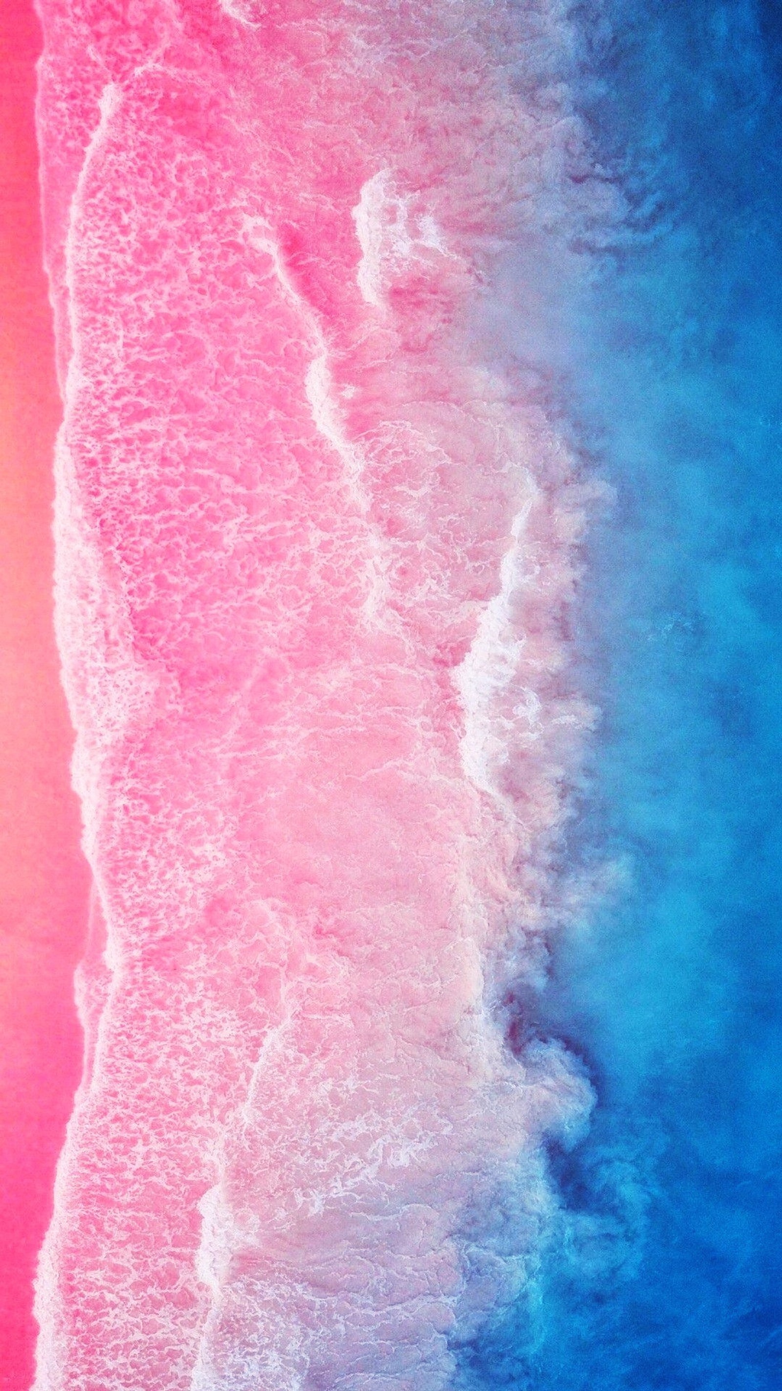 Vista aérea de una playa con una ola rosa y azul (azul, galaxia, huawei, iphone, p30)