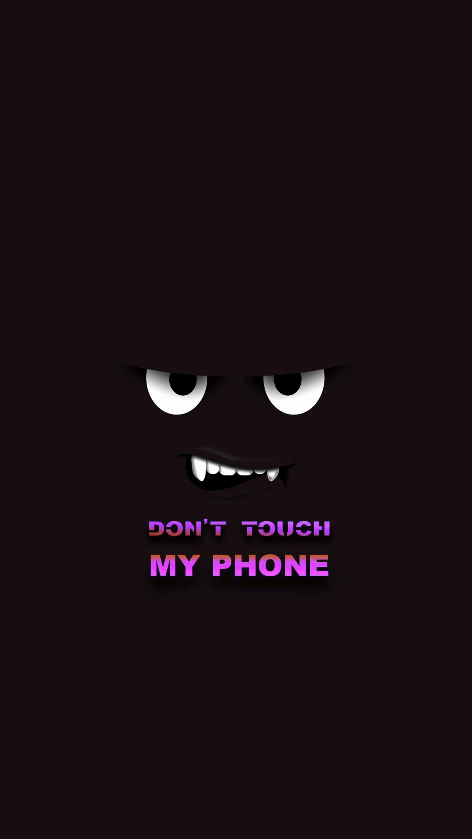 A close up of a cell phone with a dark background (dont, phone, saying, scary, touch)