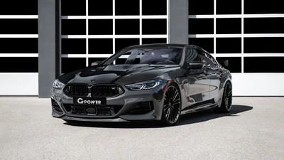 Sleek BMW M850i xDrive Gran Coupé by G-Power in a modern garage setting.