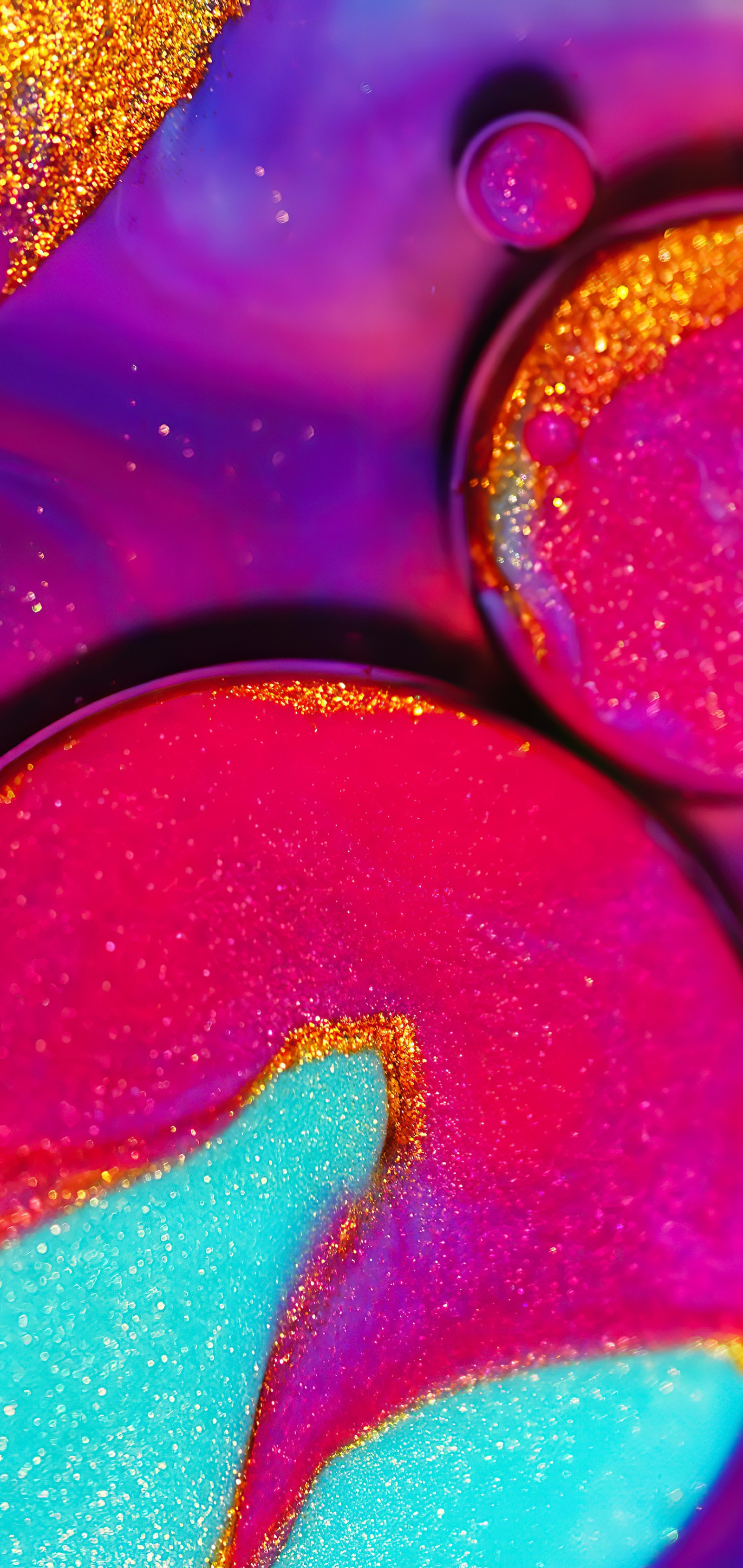 A close up of a colorful liquid substance with a blue center (light, visual arts, colorfulness, liquid, purple)