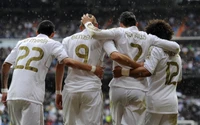 Real Madrid Players Celebrating Team Spirit in UEFA Champions League Match