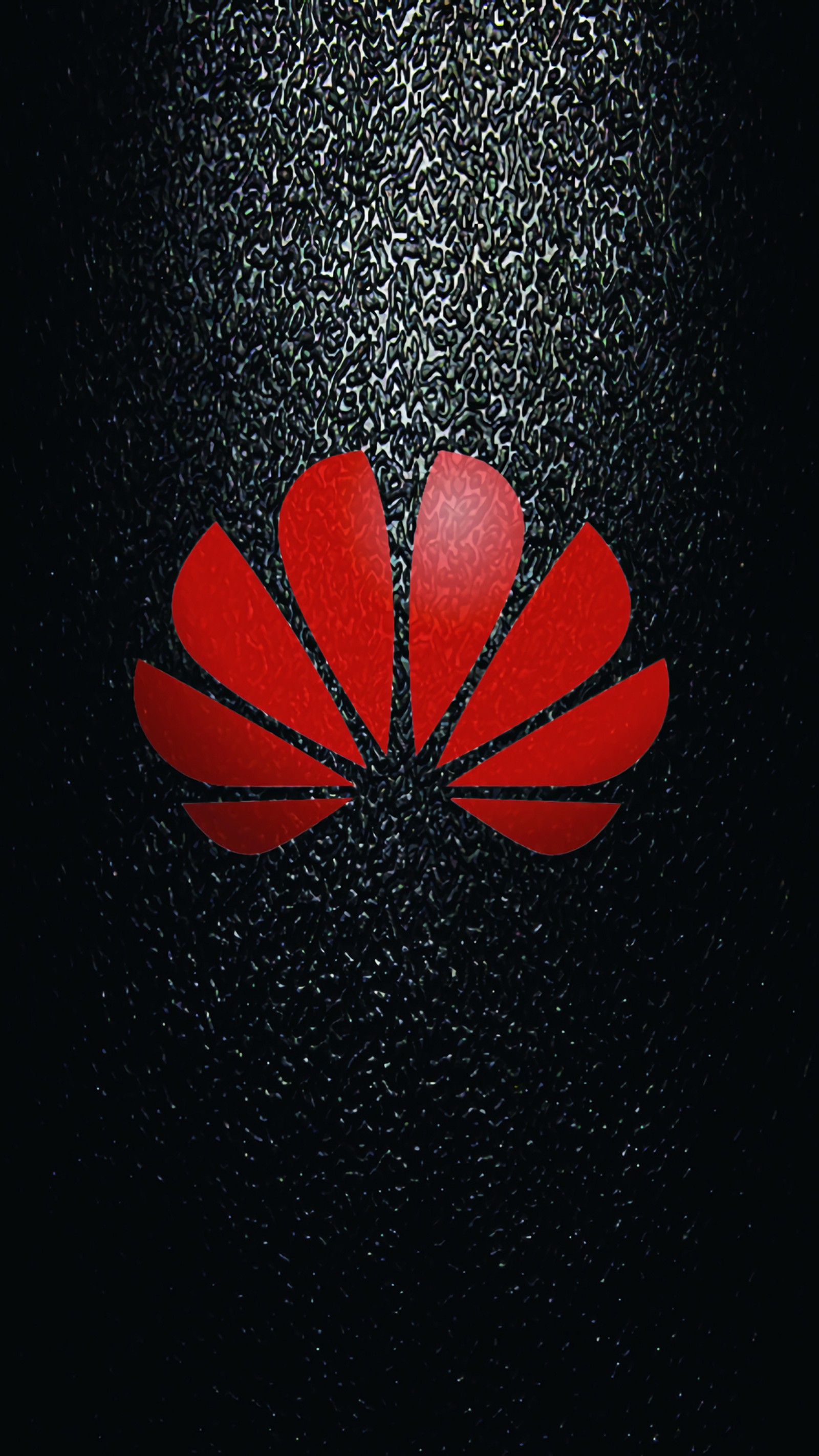 Un primer plano de un logo rojo sobre una superficie negra (negro, huawei)