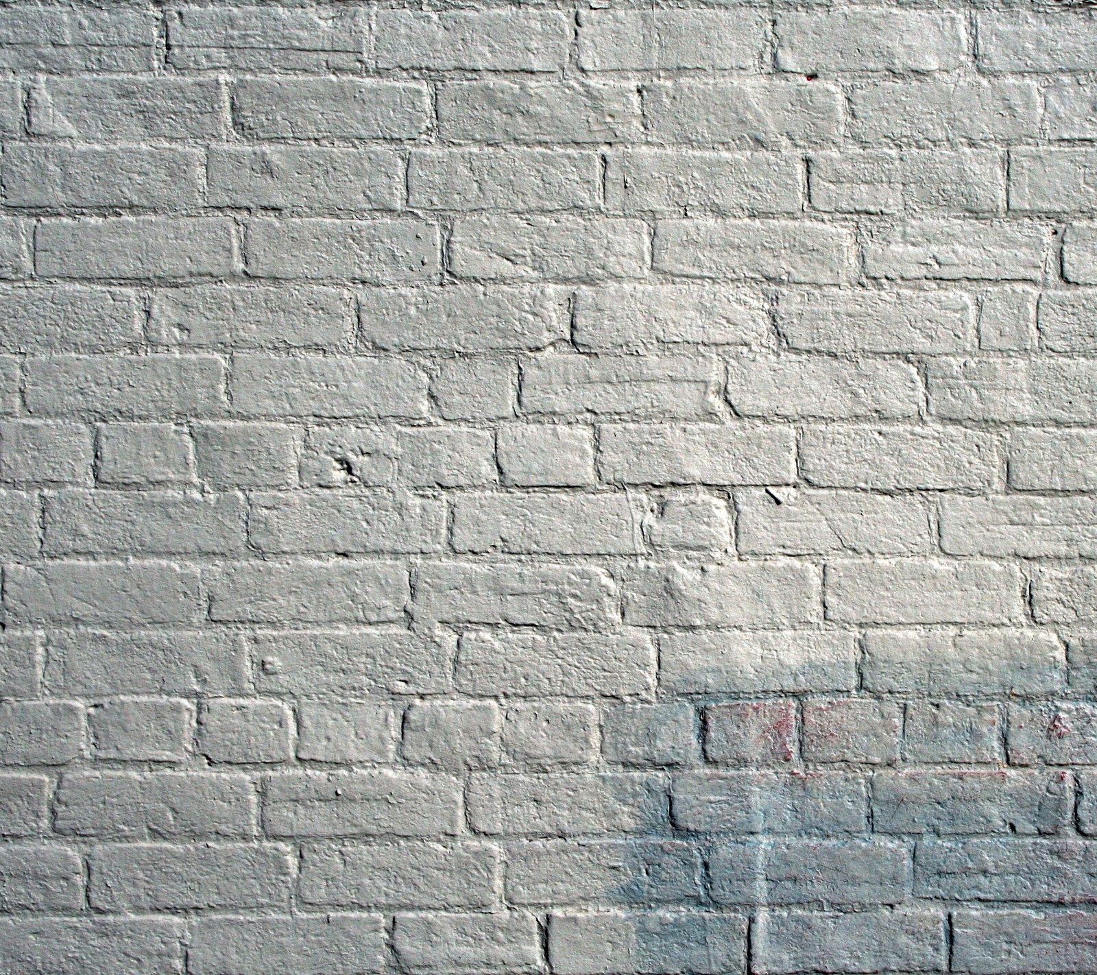 Arafed brick wall with a fire hydrant in front of it (hd, texture)