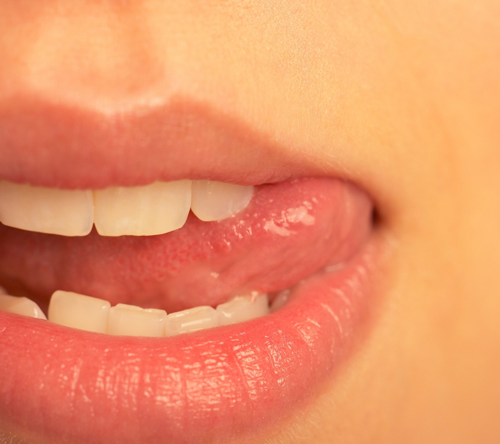 There is a close up of a woman's mouth with a toothbrush (1 2, 1 3)