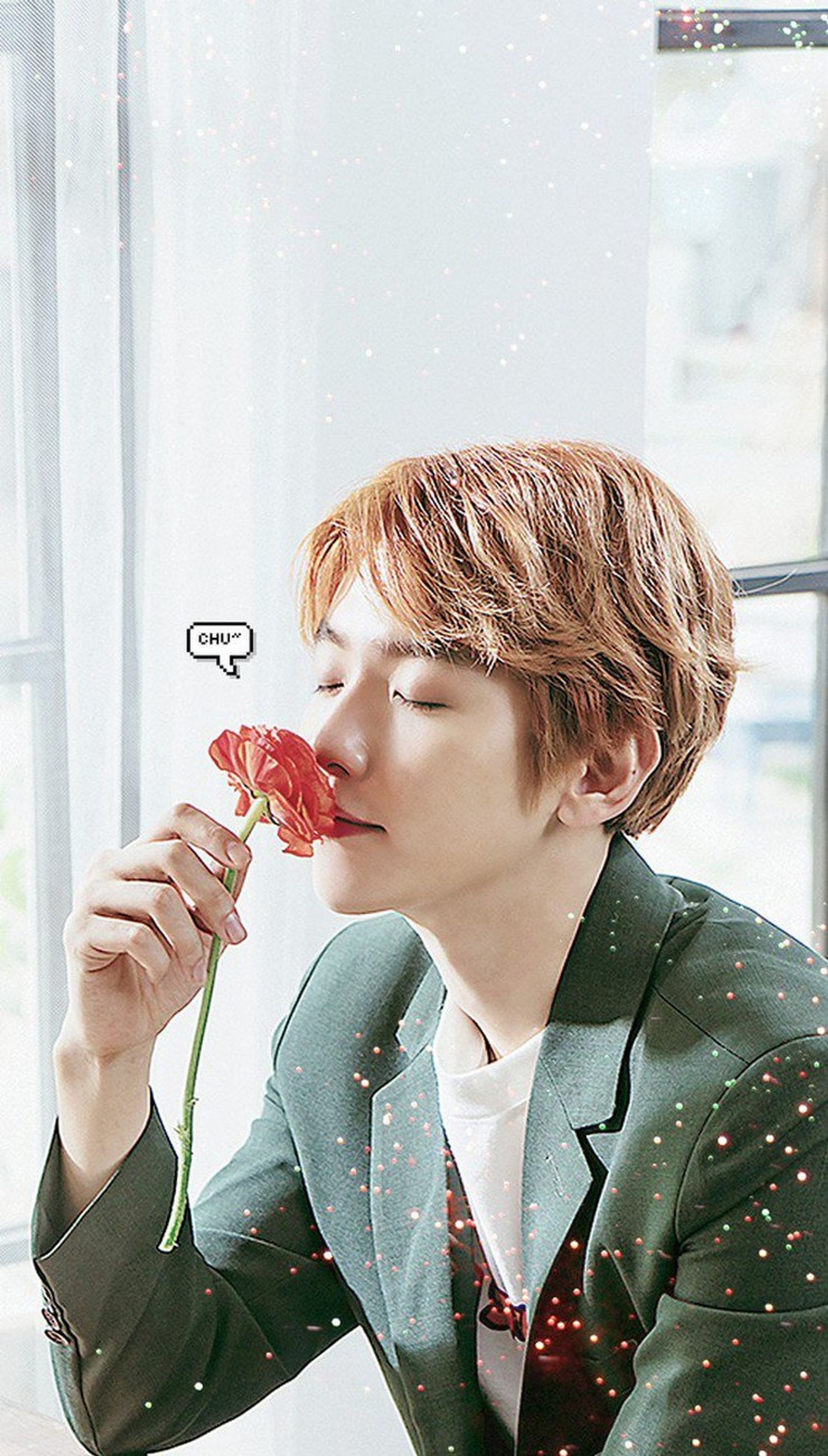 Il y a un homme qui tient une fleur dans sa main (baekhyun, bg, exo, fleur, fleurs)