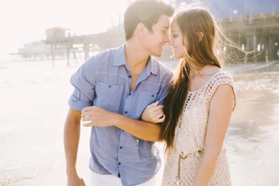 Romantic Beach Embrace: A Loving Couple Under Sunlight