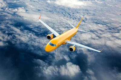 Yellow Airliner in Flight Above the Clouds