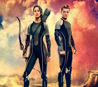 Action-geladenes Duo: Katniss und Peeta in einer dystopischen Landschaft