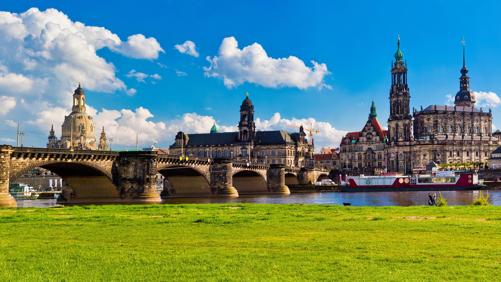 A large bridge over a river with a castle in the background (dresden, landmark, river, city, tourism)