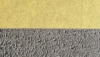 Mur texturé avec des surfaces jaunes et grises