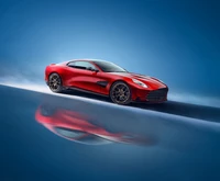 Aston Martin Vanquish 2024 sur un fond bleu - fond d'écran de super voiture de sport