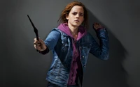 Emma Watson als Hermine Granger, die einen Zauberstab in einer Jeansjacke hält und Stärke und Entschlossenheit verkörpert.