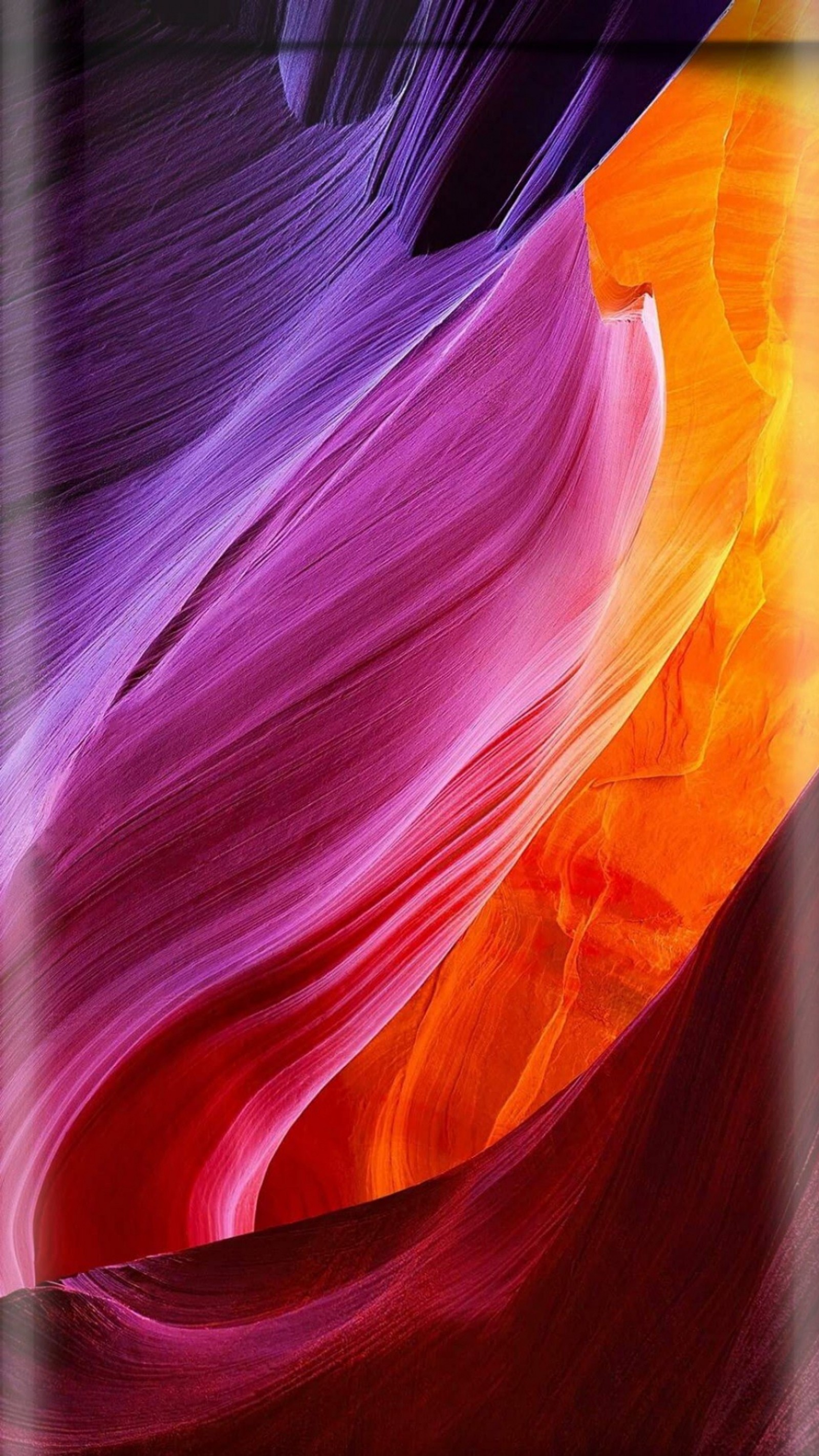 A close up of a colorful rock formation with a black background (abstract, beauty, colorful, edge, orange)