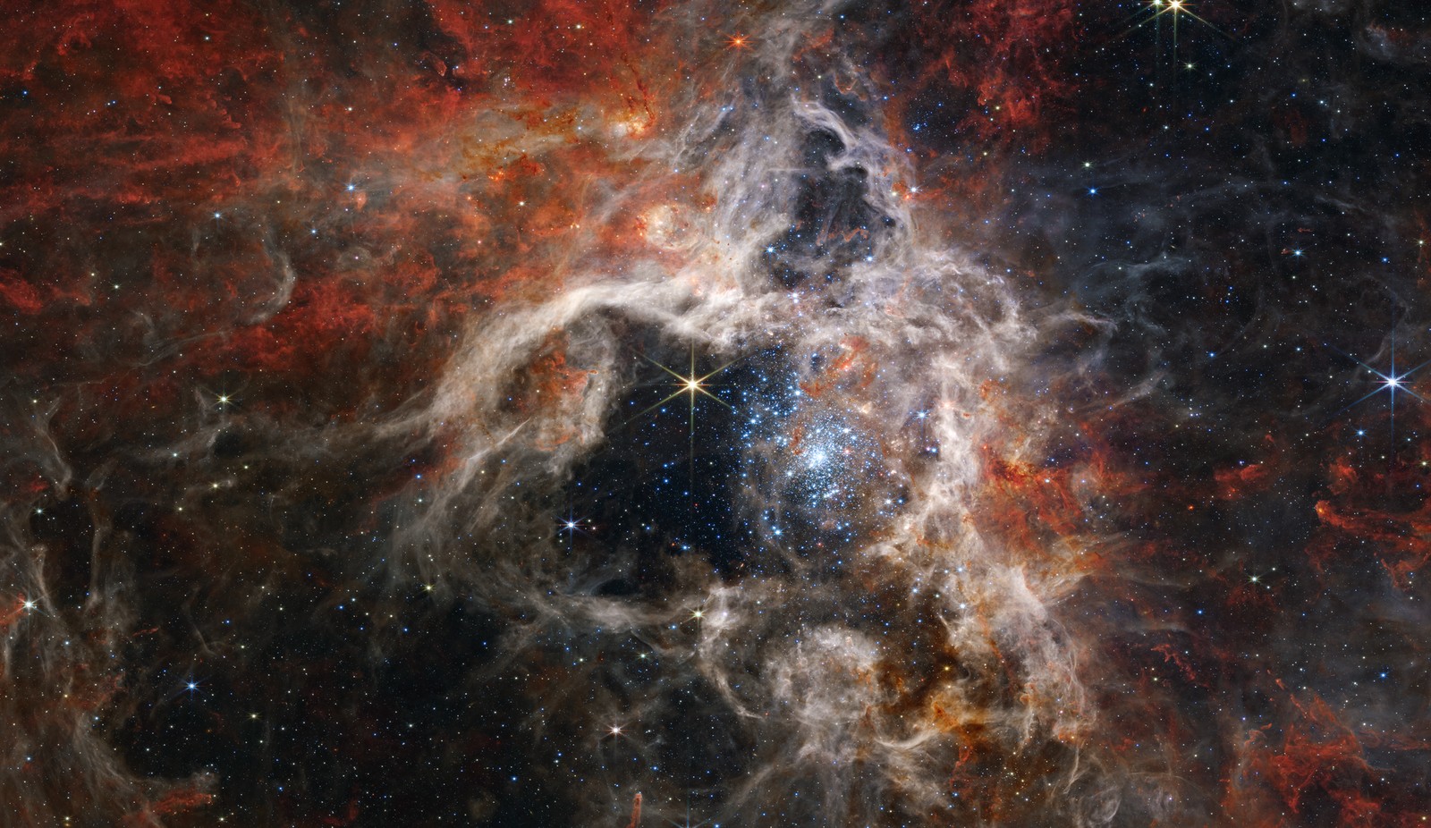 Un primer plano de un cielo lleno de estrellas con una gran estrella (espacio, nebulosa, telescopio espacial, galaxia, telescopio)