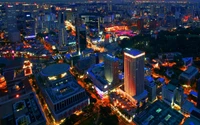 Paisaje urbano nocturno de Singapur: Una metrópoli vibrante iluminada