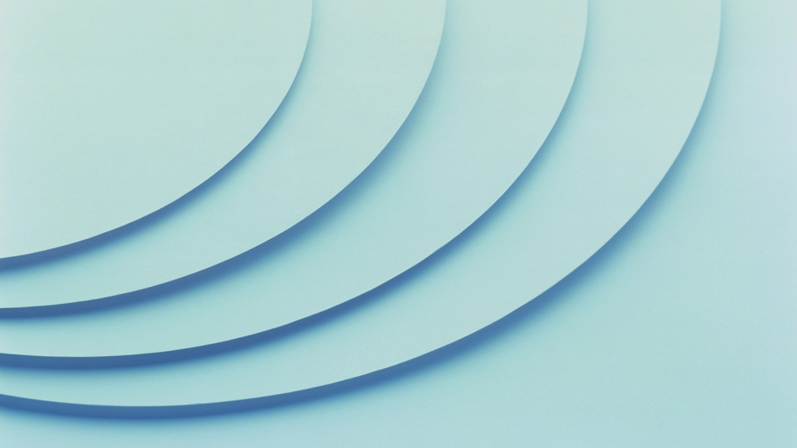 A close up of a blue background with a curved design (shape, texture, blue, aqua, line)