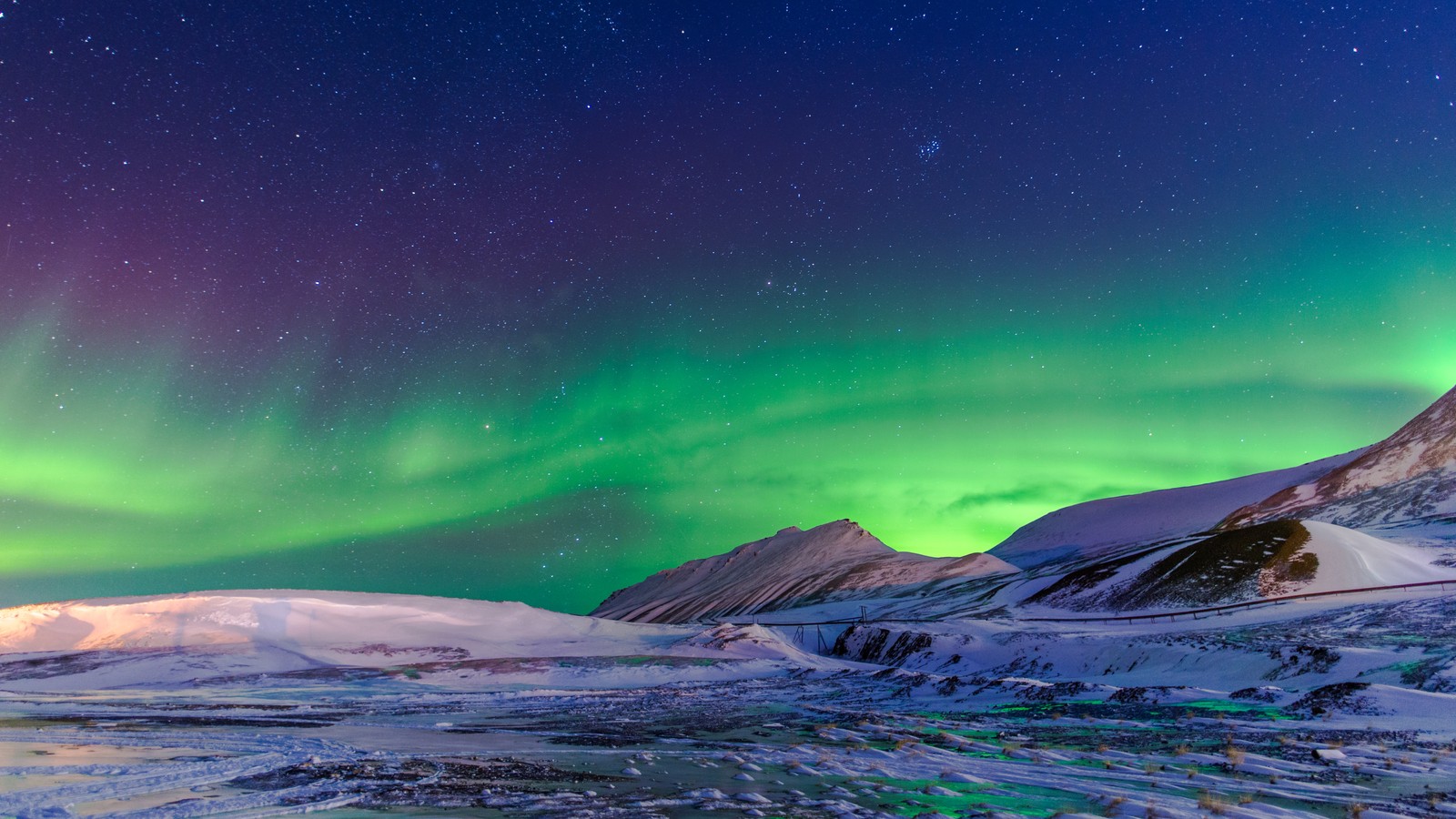 A green and purple aurora bore over a snowy mountain range (4k, galaxy, landscape, light, lights)