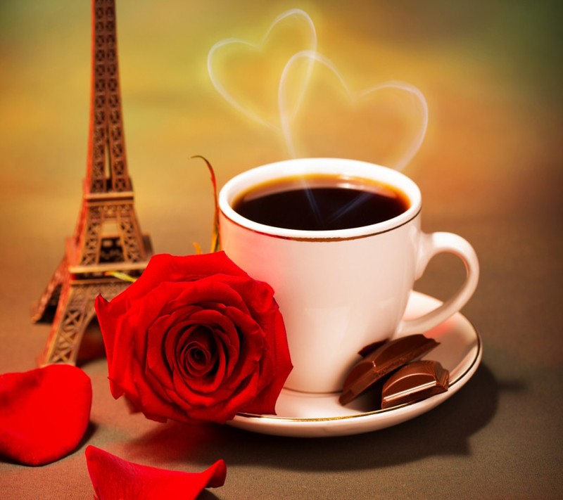 Hay una taza de café y una rosa en un platillo (parís, paris, fondo de pantalla)