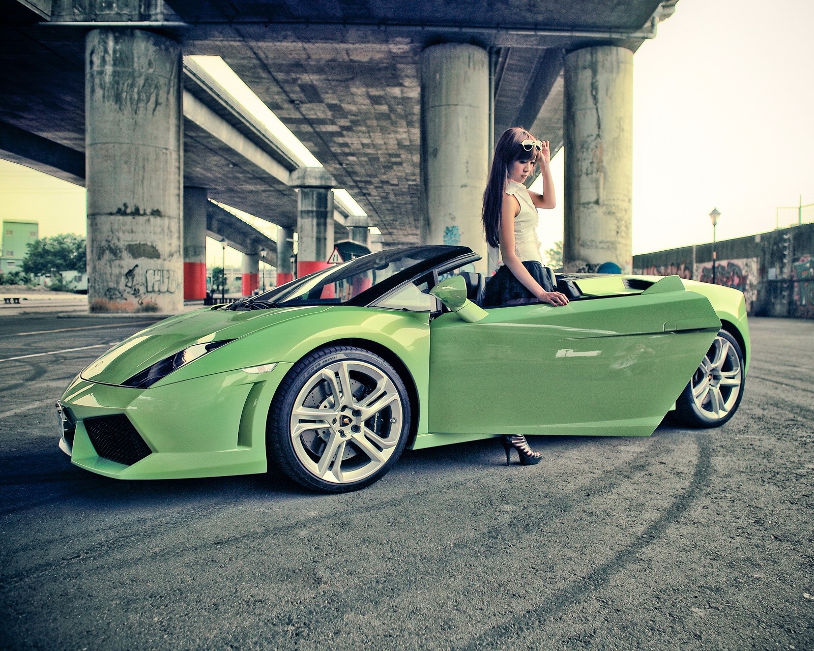 Arafed woman sitting in a green sports car in a parking lot (car, cars, gallardo, girl, green)