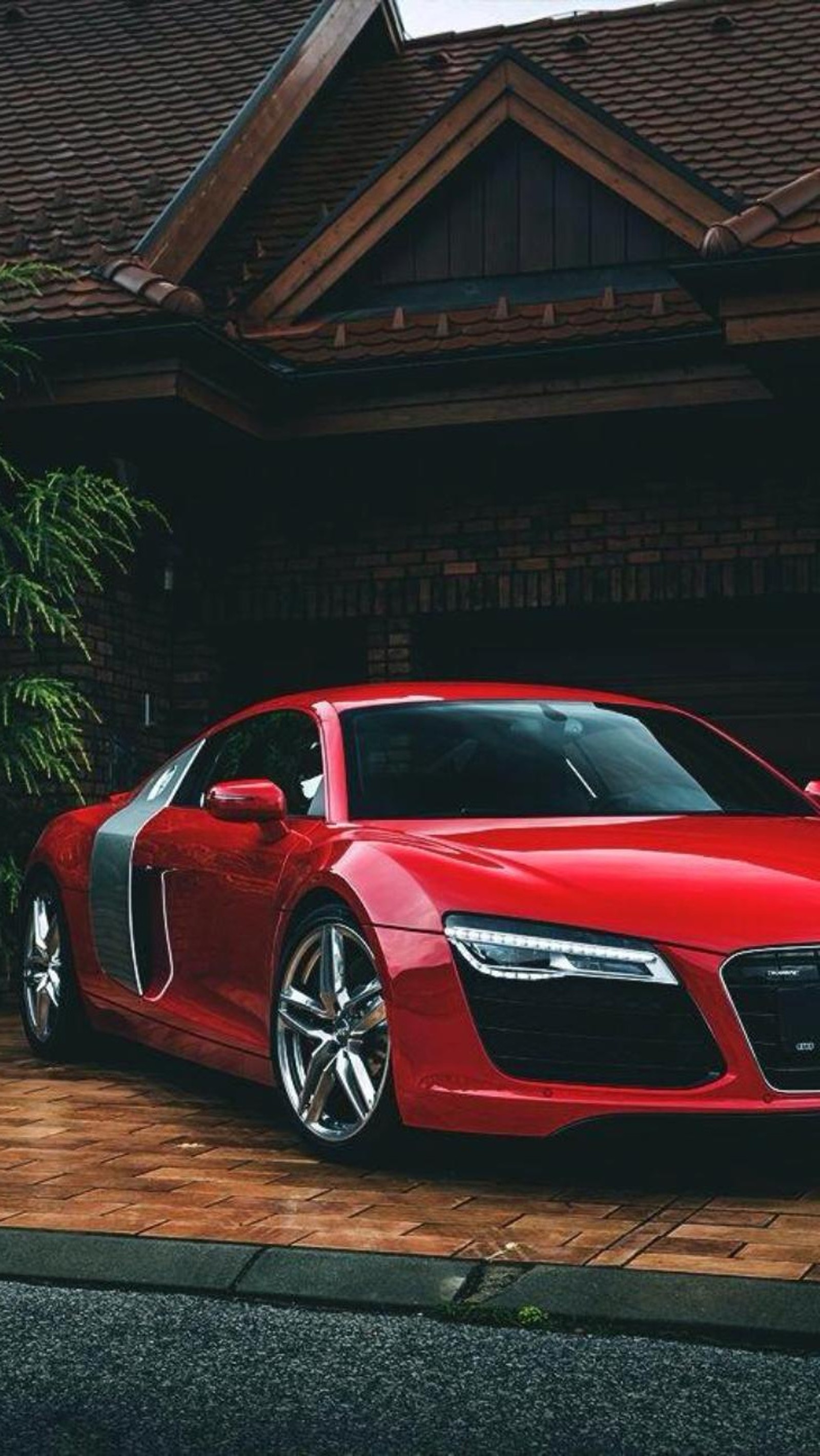 A close up of a red sports car parked in front of a house (audi r8, car, new, red)