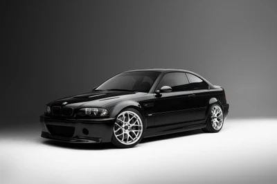 BMW M3 E46: Un elegante coche deportivo negro con llantas plateadas