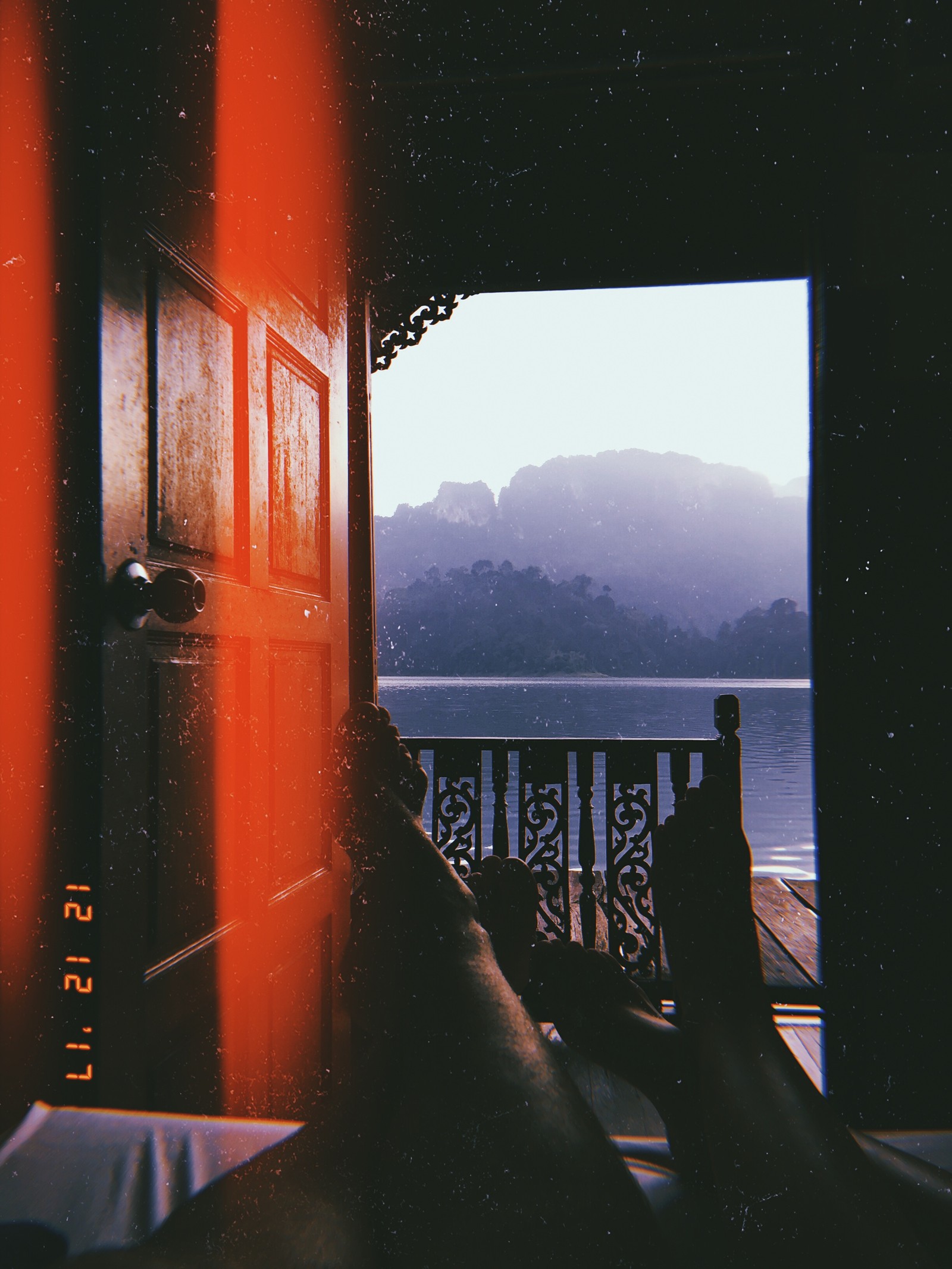 Someone is sitting on a porch with their feet up (reflection, water, mathematics, geometry, lake district)