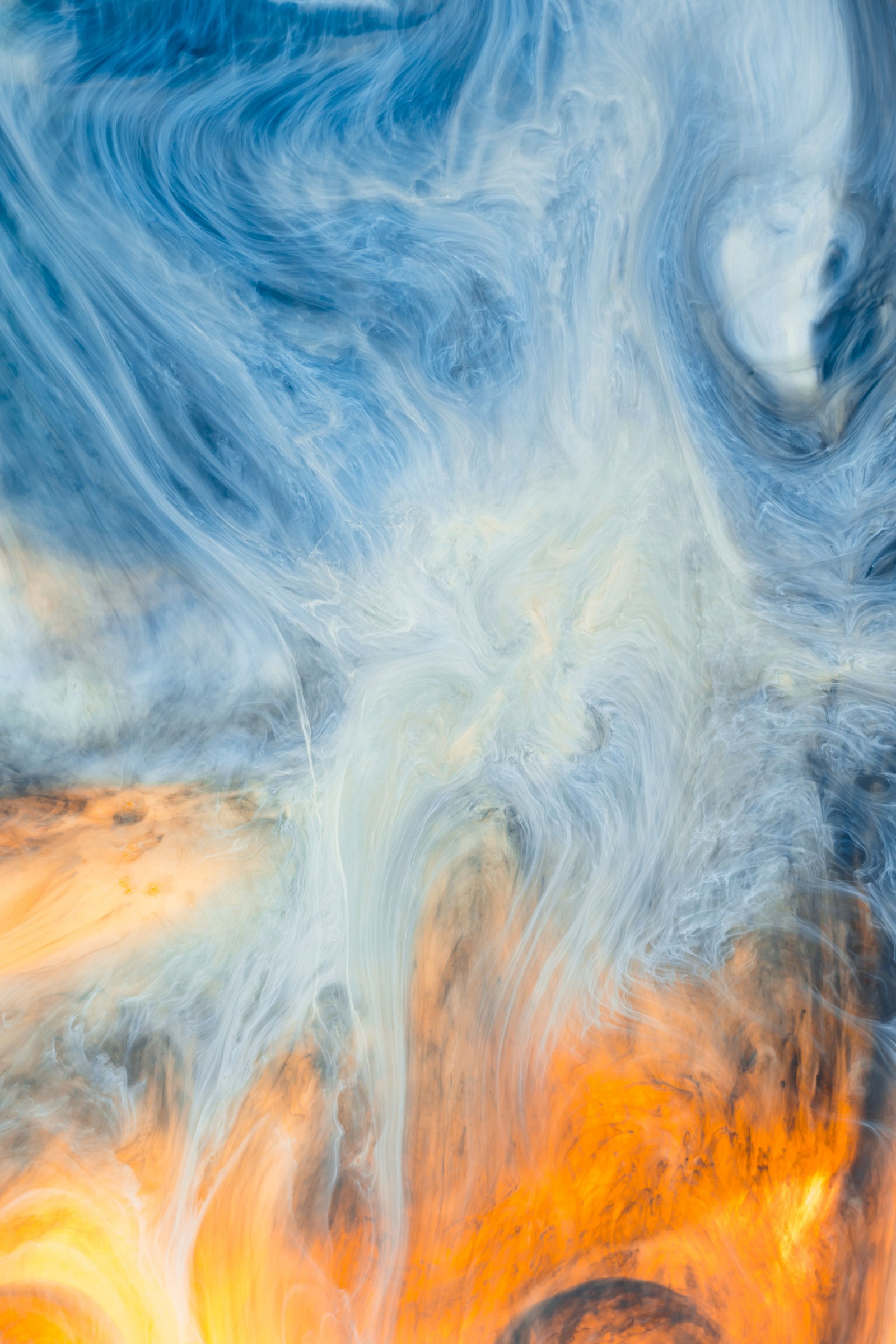 A close up of a painting of a sky with clouds and a fire (blue, water, wave, acrylic paint, creative arts)