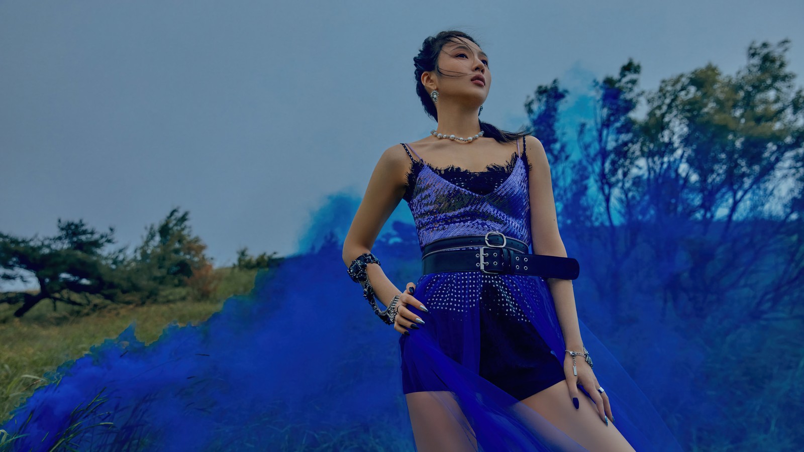 Araffe woman in a blue dress posing in front of a blue smoke cloud (red velvet, kpop, k pop, girl group, korean)